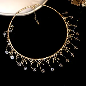 Macro view of elegant gold lace fringe choker featuring delicate crystal bead drops