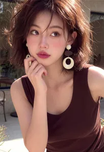 Detailed view of French retro hollow round acrylic and wood drop earrings on a model