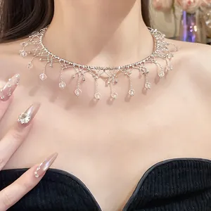 Detailed close-up of an elegant silver vintage fringe choker necklace with crystal drops.