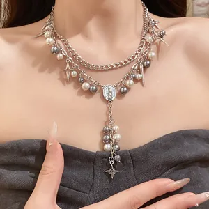 Double layer pearl necklace with gothic oval pendant and star charms for women.
