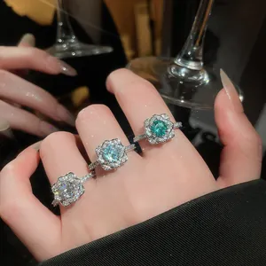 Detailed view of three sparkling flower zircon open rings in various elegant colors.