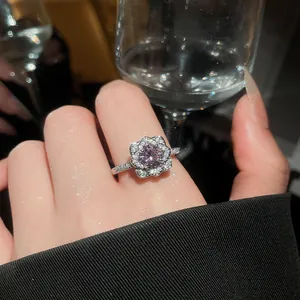 Macro shot of a sparkling purple zircon flower ring with exquisite petal design details