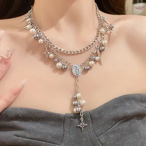 Double-layer silver chain necklace with pearls and religious oval pendant worn on neck