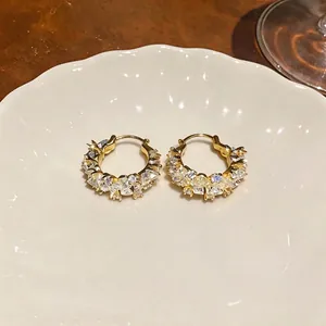 Exquisite 14k gold plated hoop earrings featuring sparkling cubic zirconia stones