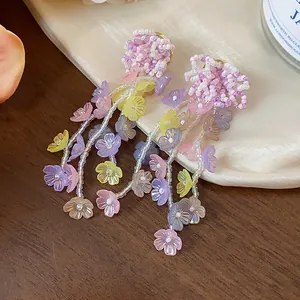 Detailed close-up showing vibrant glass beaded flower petals on sweet drop earrings.