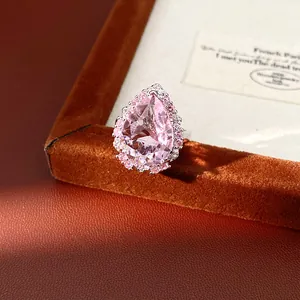 Macro view of palace style water-drop ring with pink zircon and exquisite halo stones