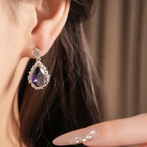 Elegant purple zircon water-drop earring in a vintage palace style worn on a female ear