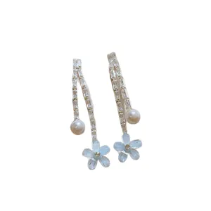 Elegant floral tassel dangle earrings featuring light blue petals and white faux pearls