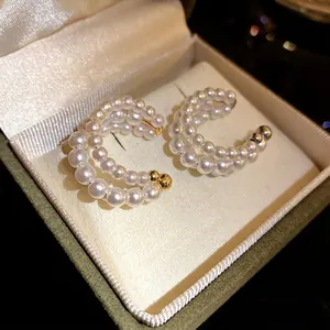 Elegant French vintage three-layer pearl beaded ear cuffs displayed in a jewelry box