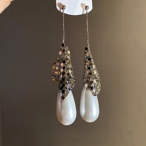 Elegant silver needle drop earrings with metallic mesh and large white teardrop pearls