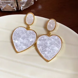 Minimalist heart drop earrings with white marble resin inlay and elegant gold plating