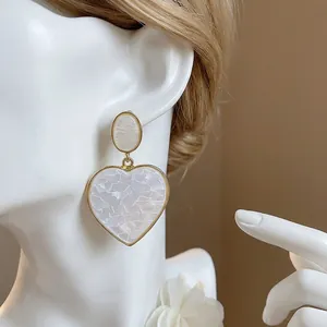 Elegant heart-shaped resin drop earrings with gold frame and S925 silver needle post