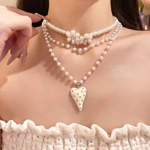 Elegant vintage multi-layer pearl necklace with floral and heart resin pendant charms