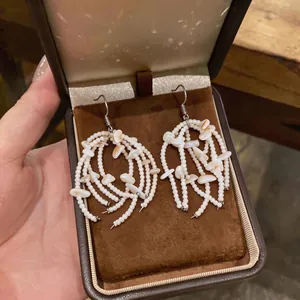 Handmade shell fringe drop earrings with white beads in a luxury gift box