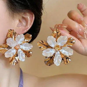 Exaggerated gold and pearl white metal flower earrings for women with rhinestone center