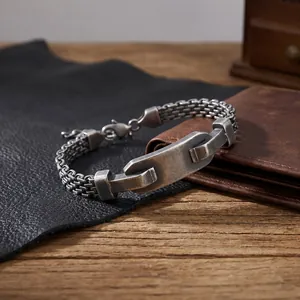 Close-up of vintage stainless steel mesh bracelet with engravable metal plate