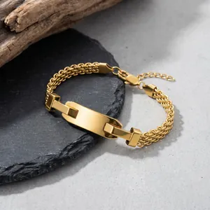 Detailed view of gold stainless steel mesh bracelet with a curved engravable plate