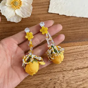 Exquisite handcrafted yellow floral dangle earrings with rhinestones and beaded tassels