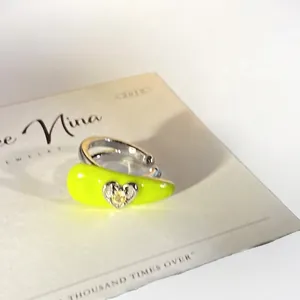 Vibrant neon yellow heart-shaped ear cuff for non-pierced ears with yellow crystal