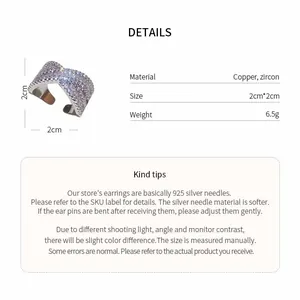 Detail view of silver X-shaped zircon ring with material and size specifications