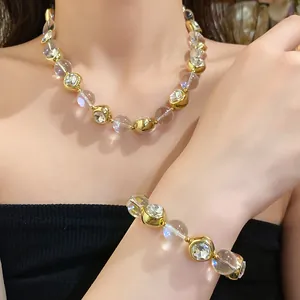 Elegant beaded necklace and bracelet set with crystal inlays and clear spheres.