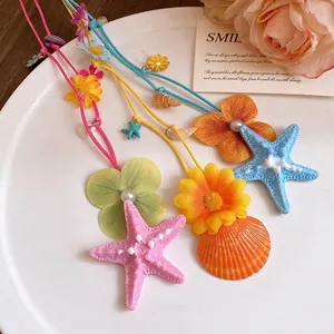 Colorful starfish and shell flower necklaces for a romantic beach vacation style