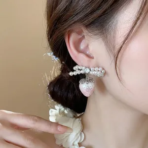 Sweet pearl bow earrings with pink strawberry pendant and silver needle design