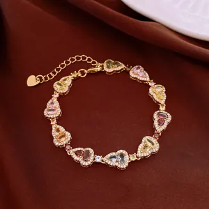 Close-up of colorful heart-shaped crystal bracelet with gold-plated adjustable chain