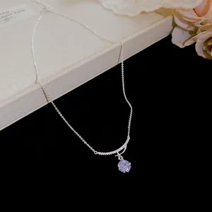 Elegant silver necklace with purple zircon flower pendant and crystal-lined bar detail.