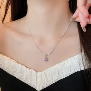 Close-up of a Korean style silver necklace with a purple zircon flower pendant