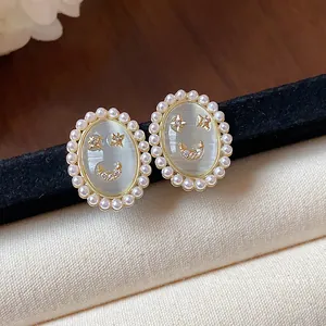 Elegant 14k gold plated smiley face stud earrings with pearls and oval cat's eye stone