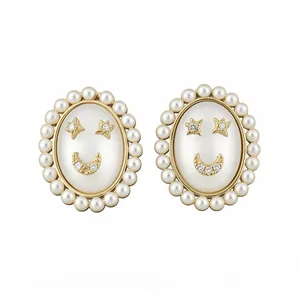 Elegant 14k gold plated silver stud earrings with pearls and a crystal smiley face