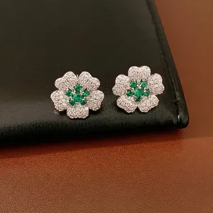 Exquisite emerald green flower earrings featuring sparkling zircon pavé for a vintage look