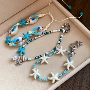 Macro view of exquisite beach vacation style bracelets with shell and starfish charms