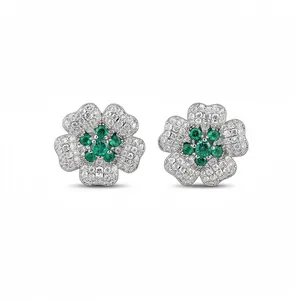Elegant silver-toned flower stud earrings with brilliant green and white cubic zirconia