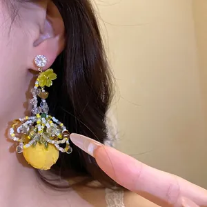 Boucles d'oreilles pendantes en fleur de tissu style vacances avec zircon