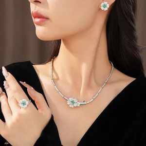 Elegant green zircon flower necklace and jewelry set worn by a model