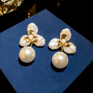 Elegant 18k gold plated floral petal pearl stud earrings with baroque pearl drop