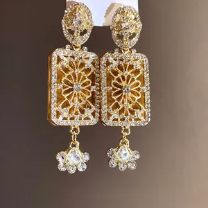 Elegant vintage court style gold-finished drop earrings with sparkling rhinestones