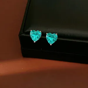 Elegant heart-shaped teal zircon stud earrings on a premium black display box