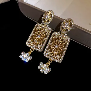 Detailed close-up of vintage court style rectangular earrings with sparkling rhinestones
