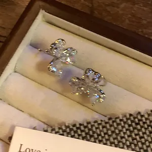 Sparkling zircon butterfly flower ear clips for non-pierced ears in a jewelry box