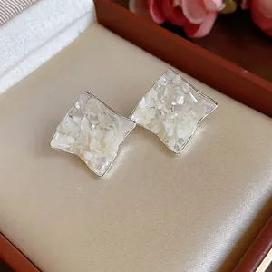 Silver needle mother-of-pearl rhombus stud earrings with crinkled shell inlay