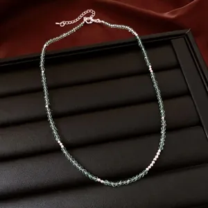 Handmade beaded necklace with light green colored zircons for layered styling
