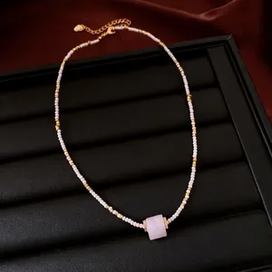 Elegant handmade white beaded necklace featuring a central pink square zircon stone pendant