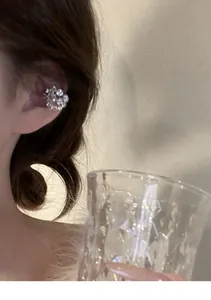 Close-up detail of a sparkly micro-pave full diamond ear cuff for non-pierced ears