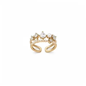 Elegant gold open ring with zircon hearts, star motifs and a central white pearl