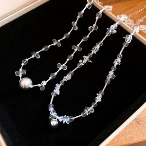Elegant minimalist crystal beaded necklace with silver spherical pendant in luxury jewelry box