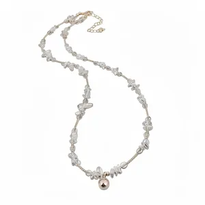 Elegant beaded necklace with clear crystals and a rose gold spherical pendant charm.