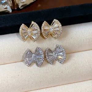Elegant 18k gold plated bow stud earrings with sparkling zircon stones
